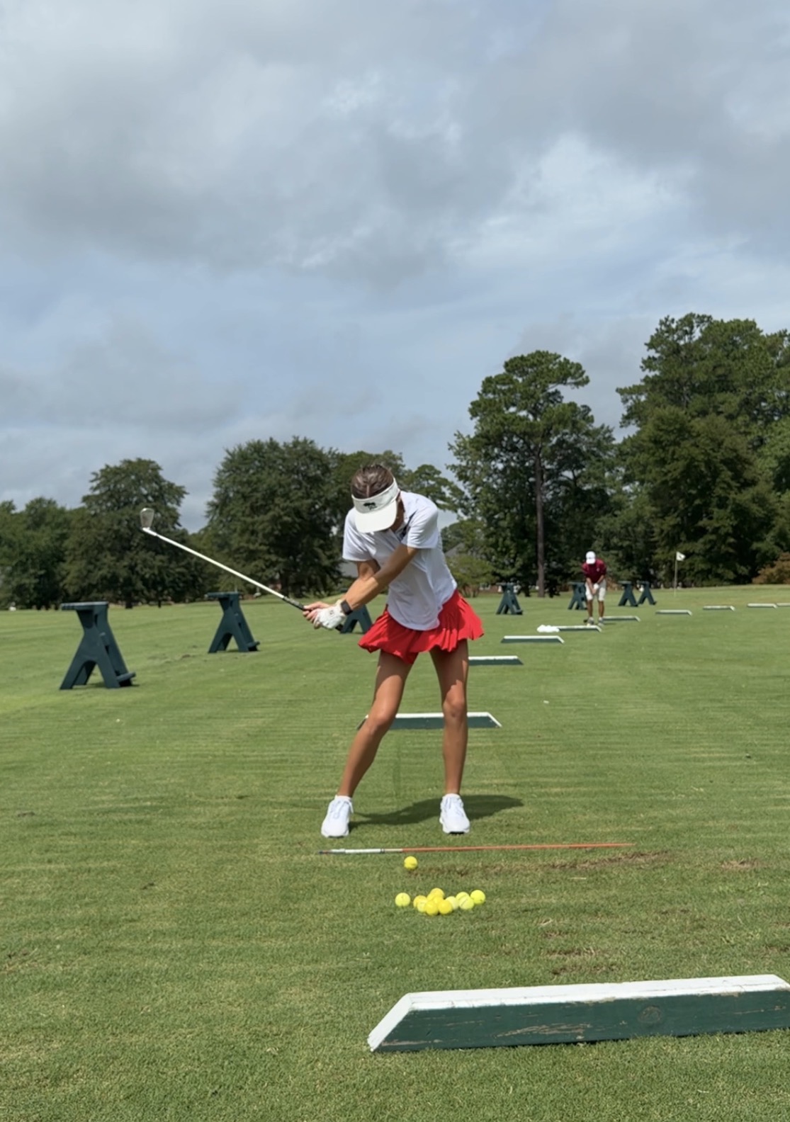 Competitive golfer practicing with purpose on the range